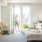 Woman in bedroom coming in her balcony door