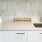 Kitchen with quartz countertops and tile backsplash