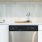 Kitchen with stainless dishwasher and tile backsplash